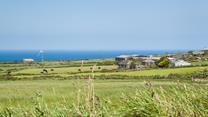 The farmhouse has stunning views of the Cornish countryside looking out to the coast.