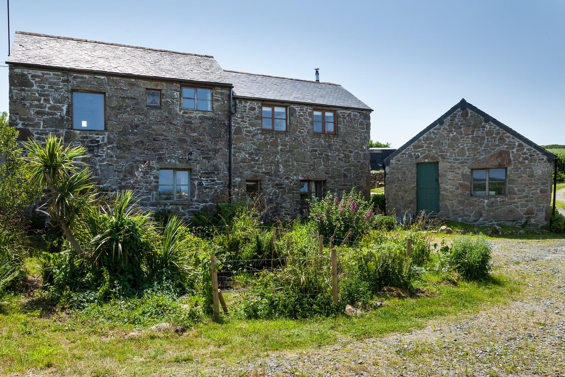 The front of the farmhouse has ample parking for your stay.