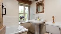 The family bathroom completes this idyllic farmhouse, unwind at the end of the day with a hot bubble bath. 