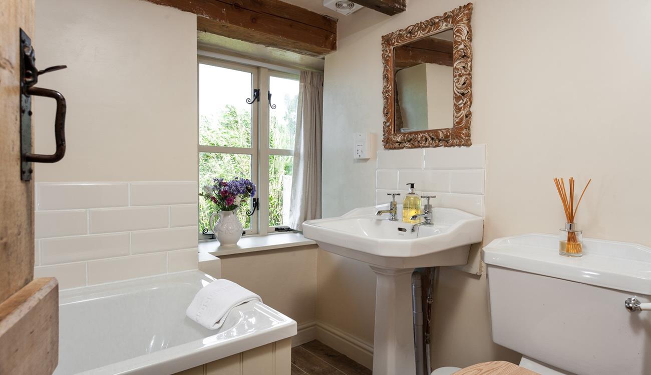 The family bathroom completes this idyllic farmhouse, unwind at the end of the day with a hot bubble bath. 