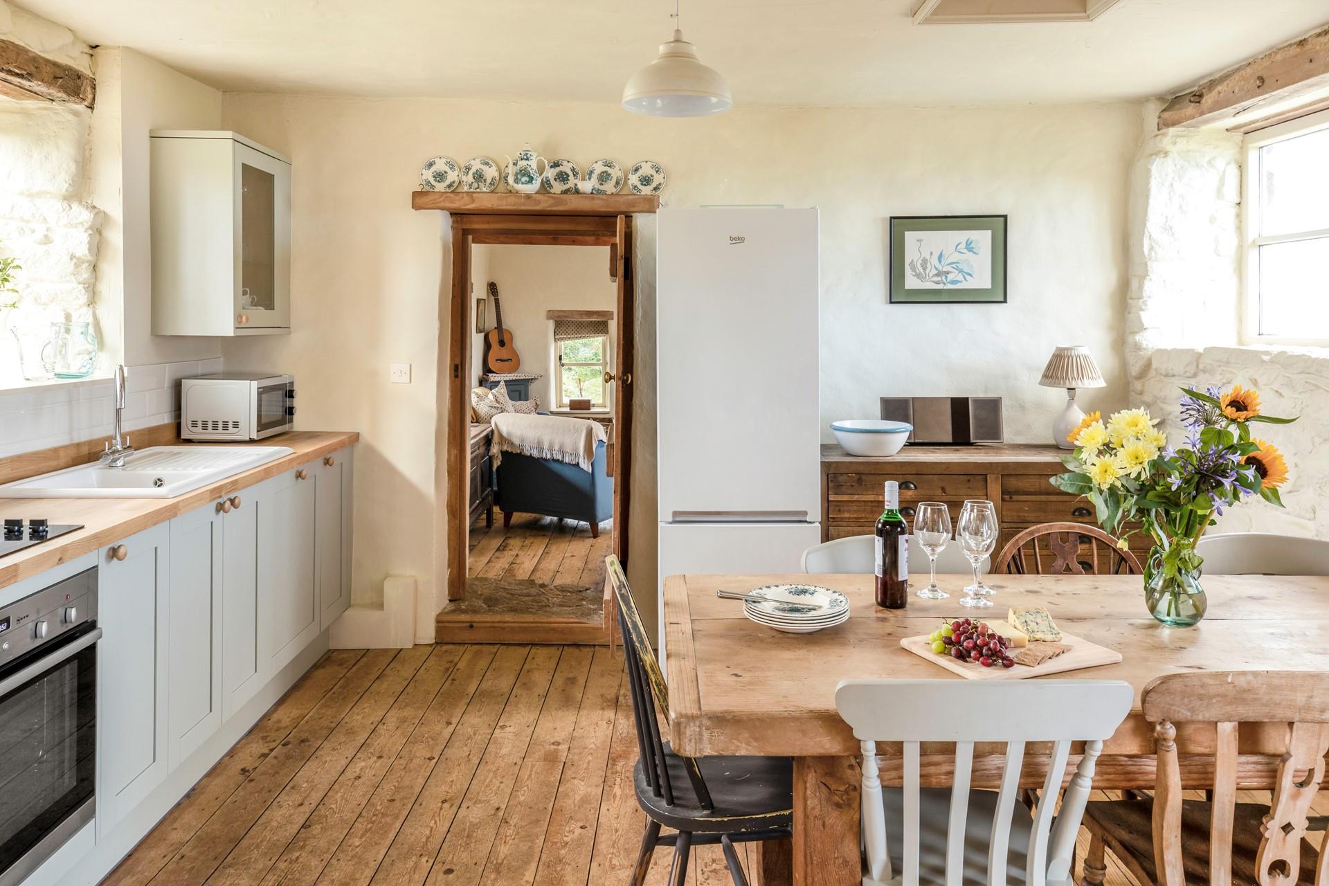 The homely cottage-style kitchen and dining area are a dream to cook and eat in.