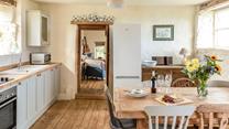 The homely cottage-style kitchen and dining area are a dream to cook and eat in.