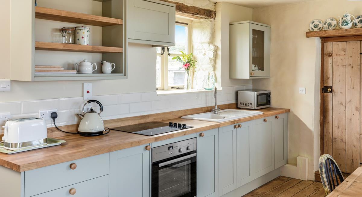 The kitchen is modern with everything needed to prepare and cook tasty meals.