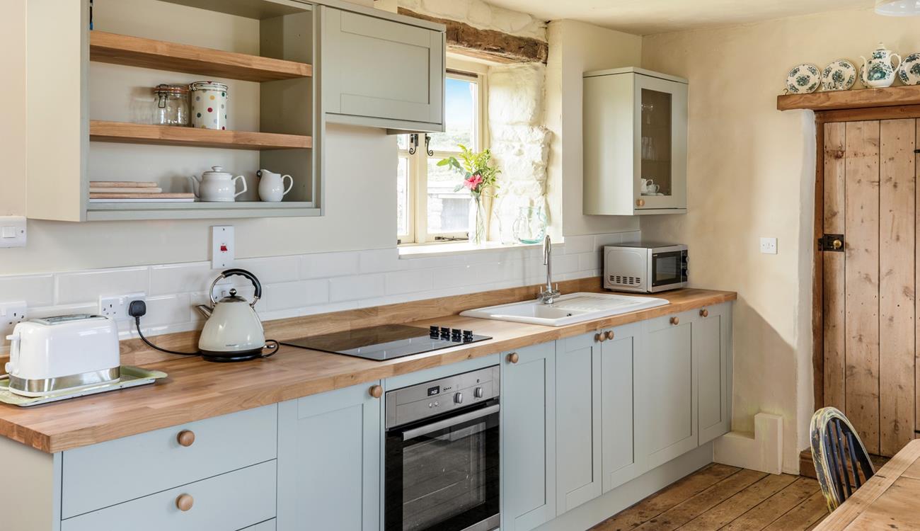 The kitchen is modern with everything needed to prepare and cook tasty meals.