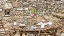 Enjoy tea and cake in the sunny garden.