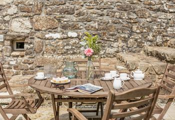 Enjoy tea and cake in the sunny garden.