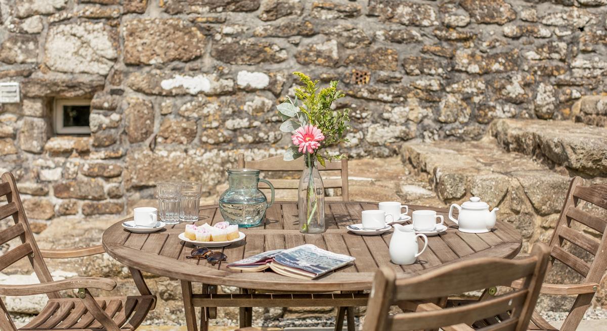 Enjoy tea and cake in the sunny garden.