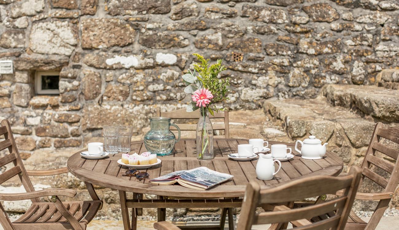 Enjoy tea and cake in the sunny garden.
