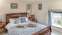 Tuck into the soft sheets of the spacious king size bed after a day of exploring.