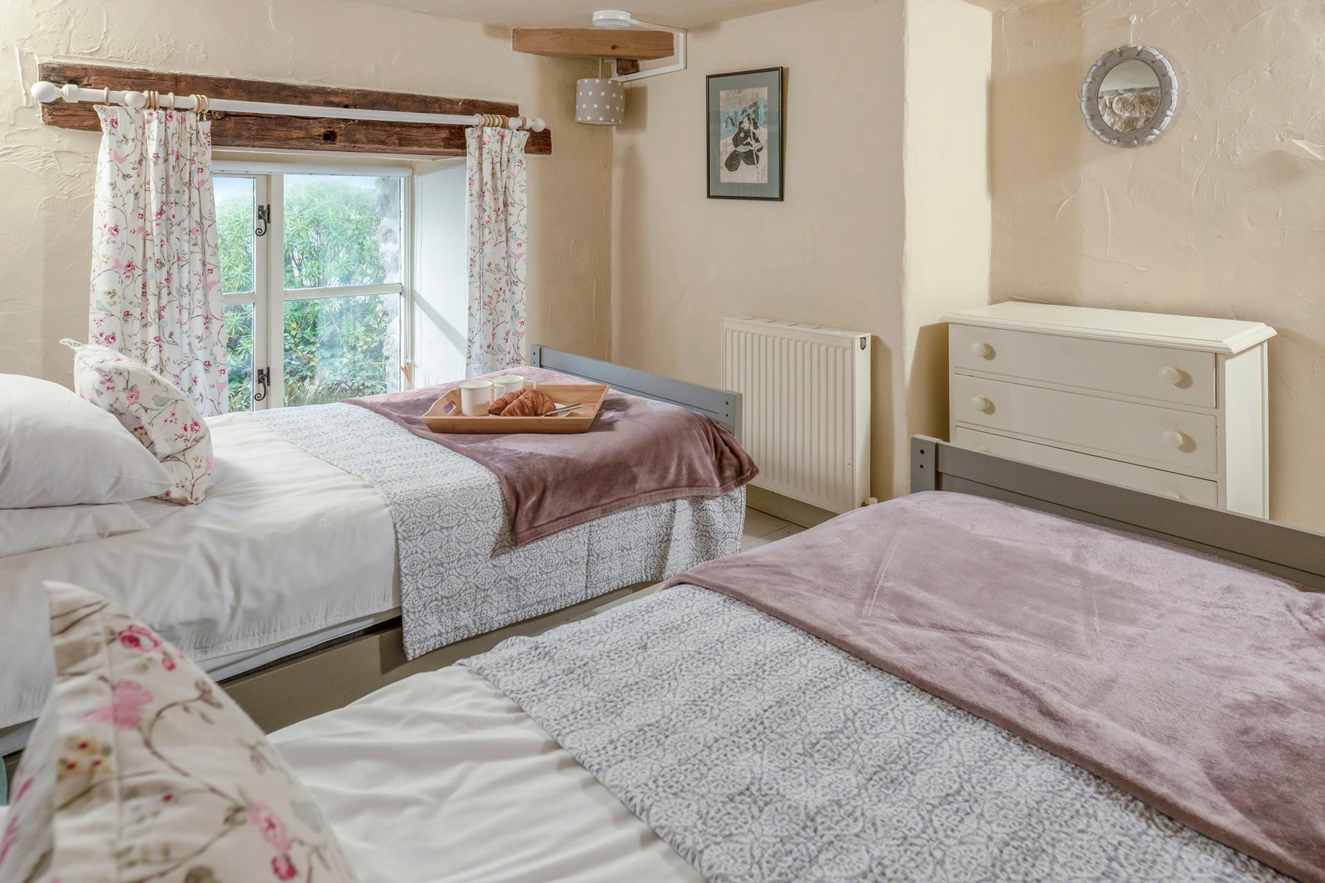 Classic cottage features create a beautifully serene bedroom.