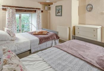 Classic cottage features create a beautifully serene bedroom.