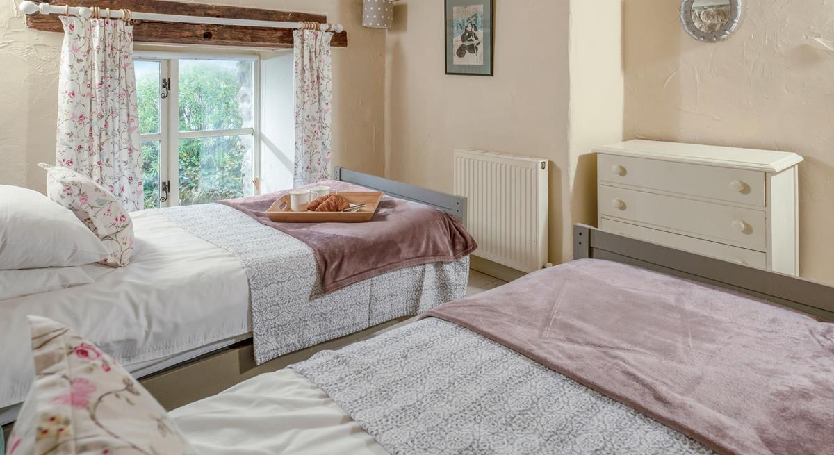 Classic cottage features create a beautifully serene bedroom.