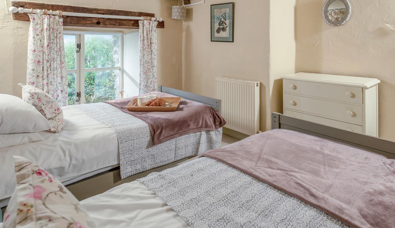 Classic cottage features create a beautifully serene bedroom.