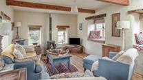 Put your feet up in the evening with a glass of wine in front of the woodburner.
