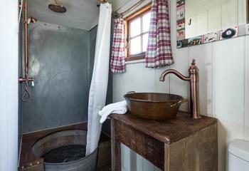 The shower room adds to the quirky and rustic finish - the shower tray is made from an old tin bath!