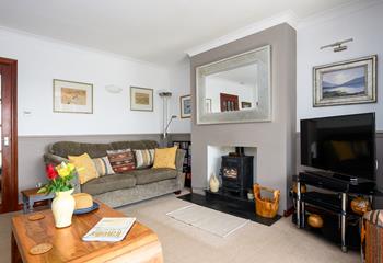 On cooler evenings, light the woodburner and get comfy on the sofas; it'll feel like a home from home. 