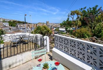 From the front courtyard, guests can view across St Ives town to the sea dancing in the distance.