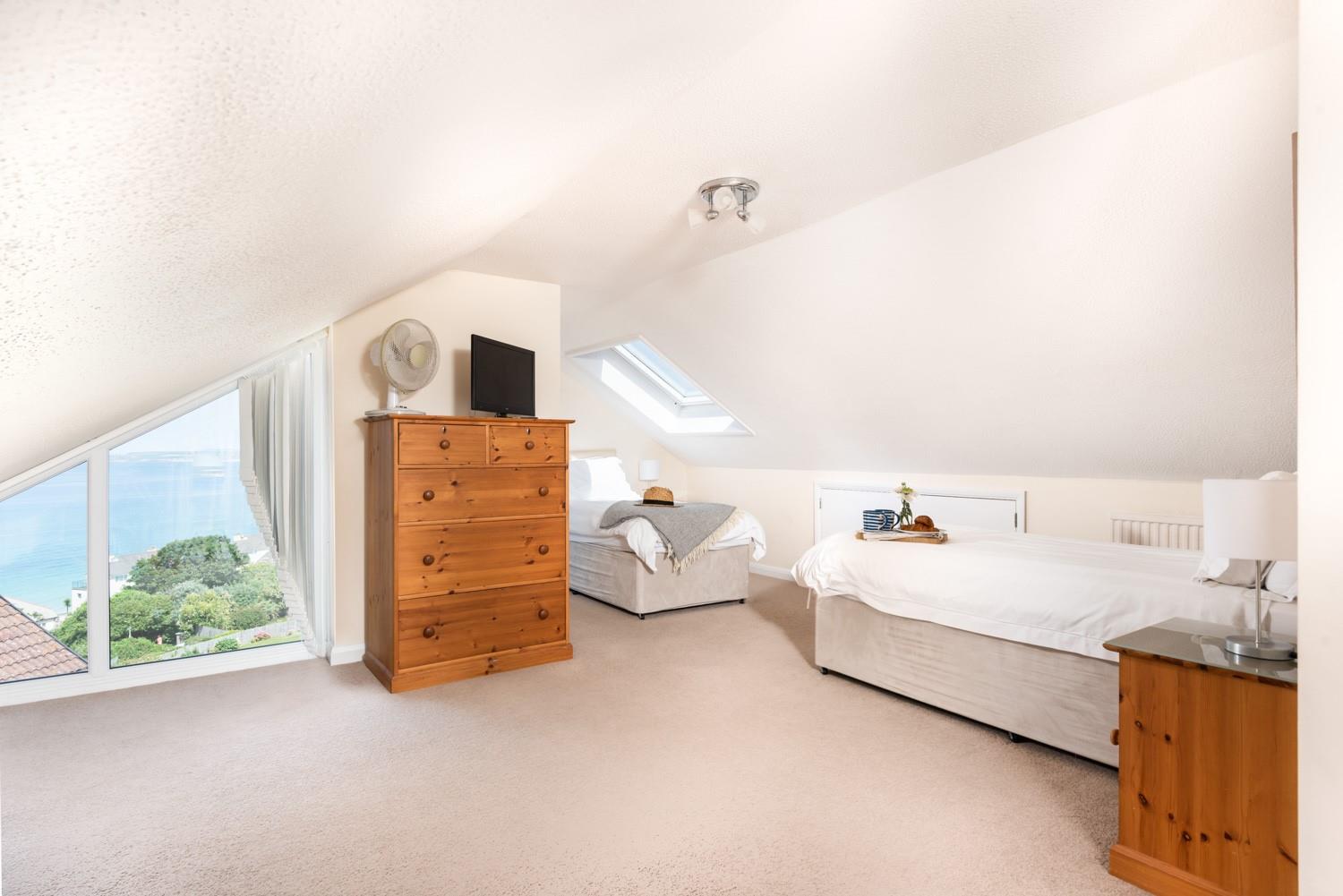 Bedroom 3 has twin beds and a fantastic sea view to wake up to each day.