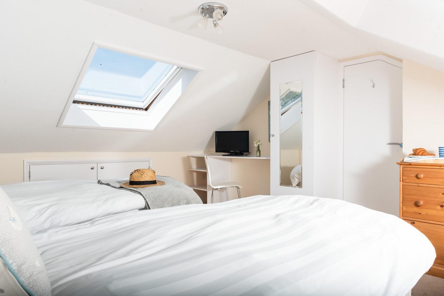 A comfortable night's sleep awaits in each bedroom.