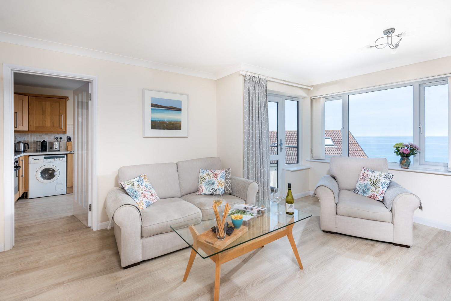 Sink into the comfortable sofa and enjoy the stunning sea views whilst sipping a glass of wine.