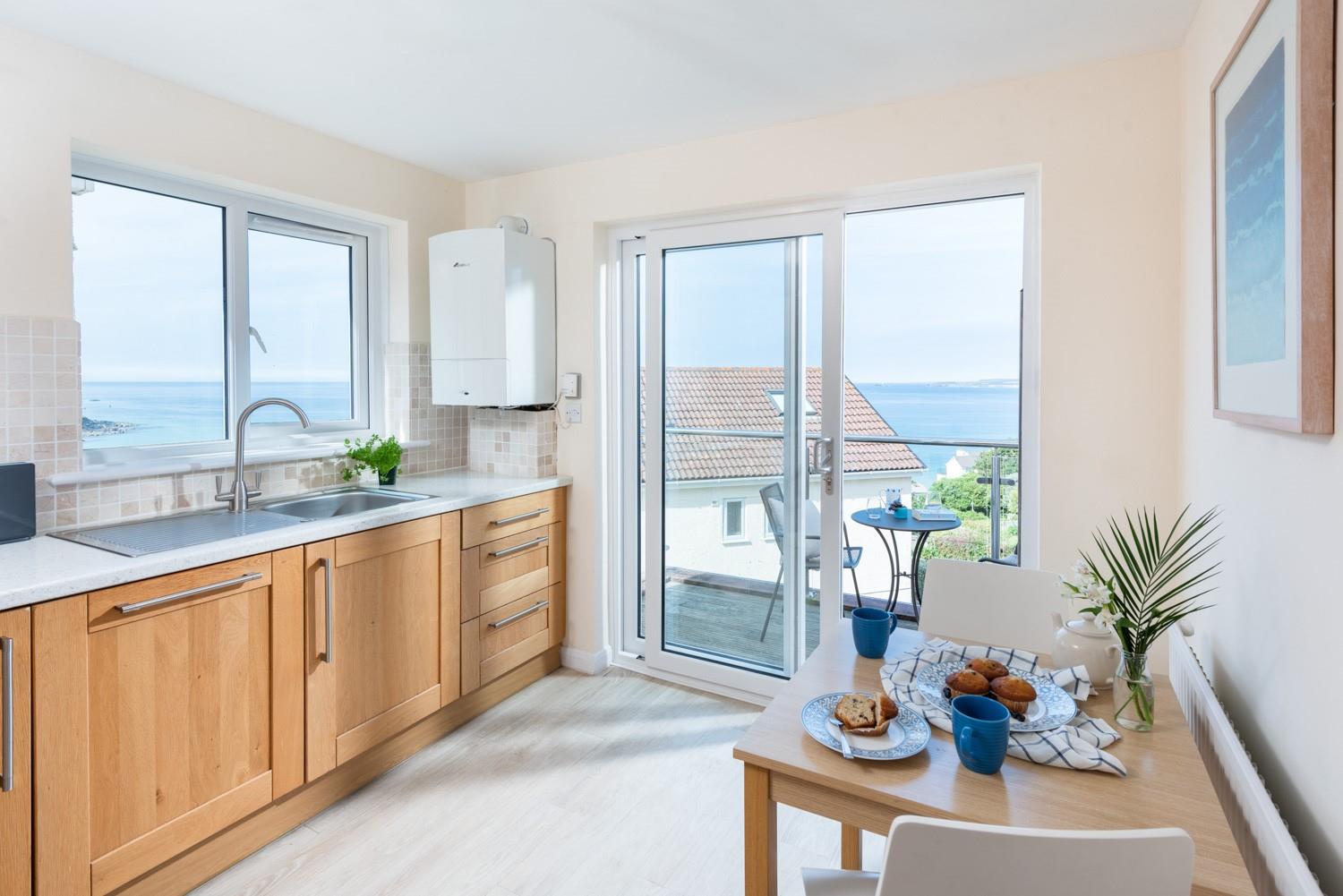 Prepare a meal in the kitchen with beautiful views.