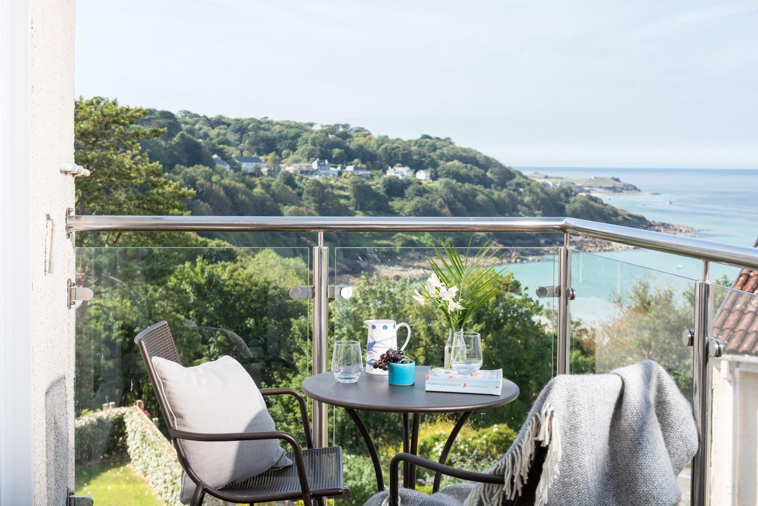 The private balcony has a stunning view of the rugged coastline. 