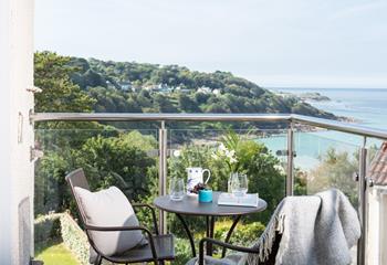 The private balcony has a stunning view of the rugged coastline. 