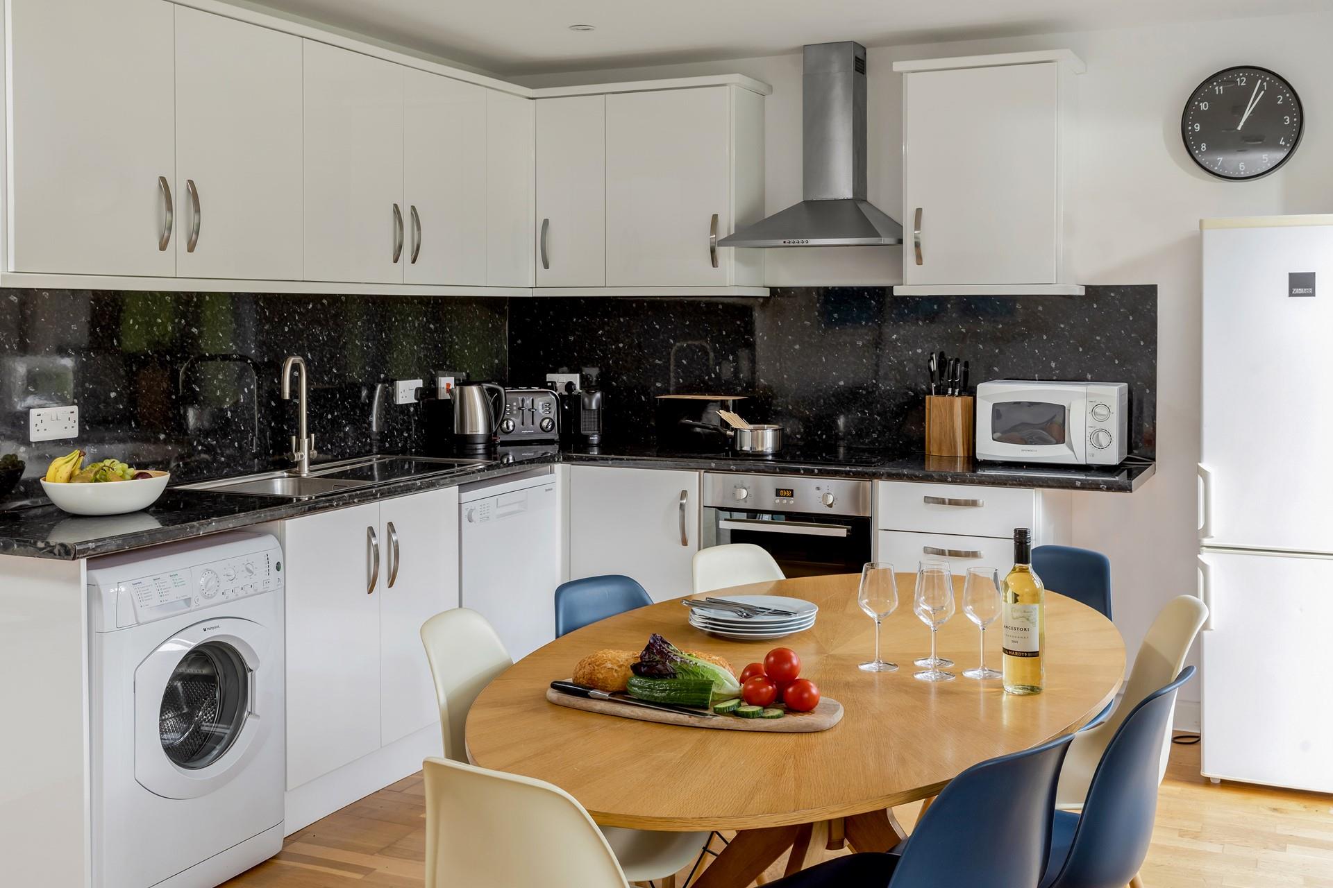 The dining table provides plenty of space for the whole family whilst the sleek kitchen is sure to delight any budding chefs!