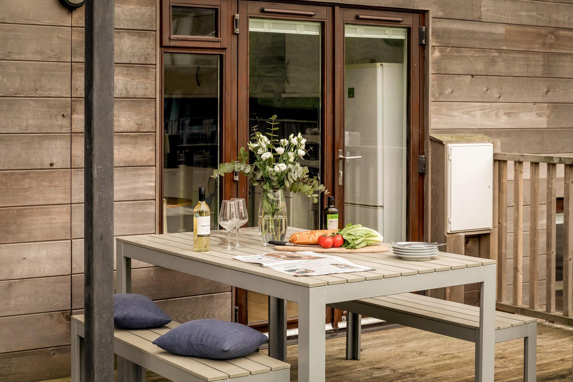 Enjoy an evening tipple on the decking after a busy day exploring the nearby beaches. 