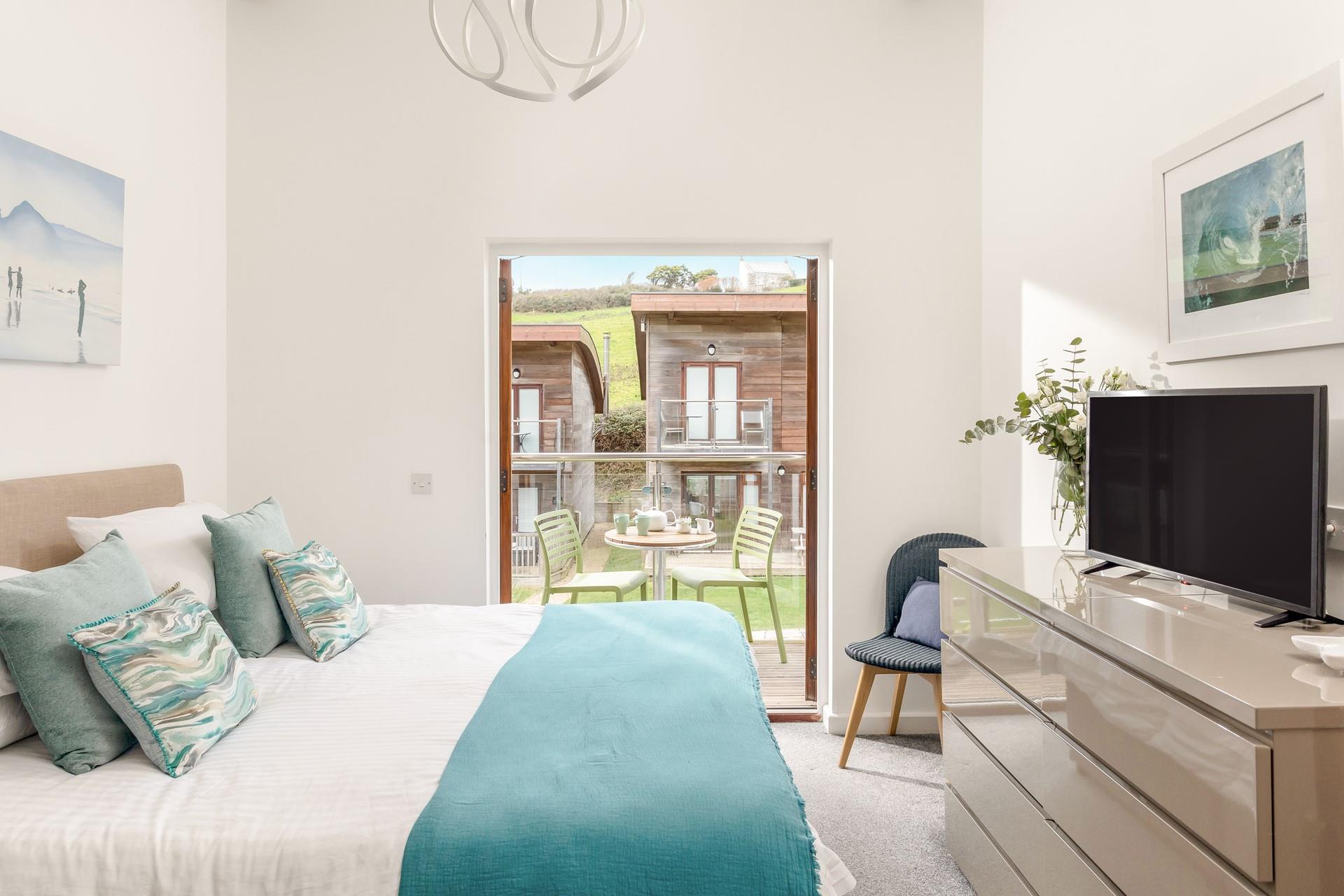 Bedroom 2 benefits from a balcony; a quiet haven for enjoying a morning cuppa or evening drinks when the kids are in bed.