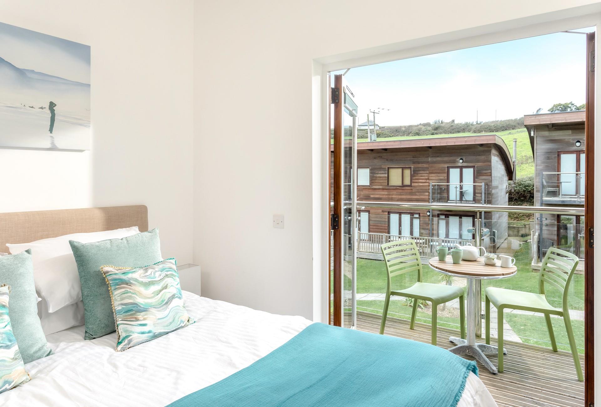 Open the doors and let the sunlight flood your bedroom, the perfect way to enjoy a lazy morning. 