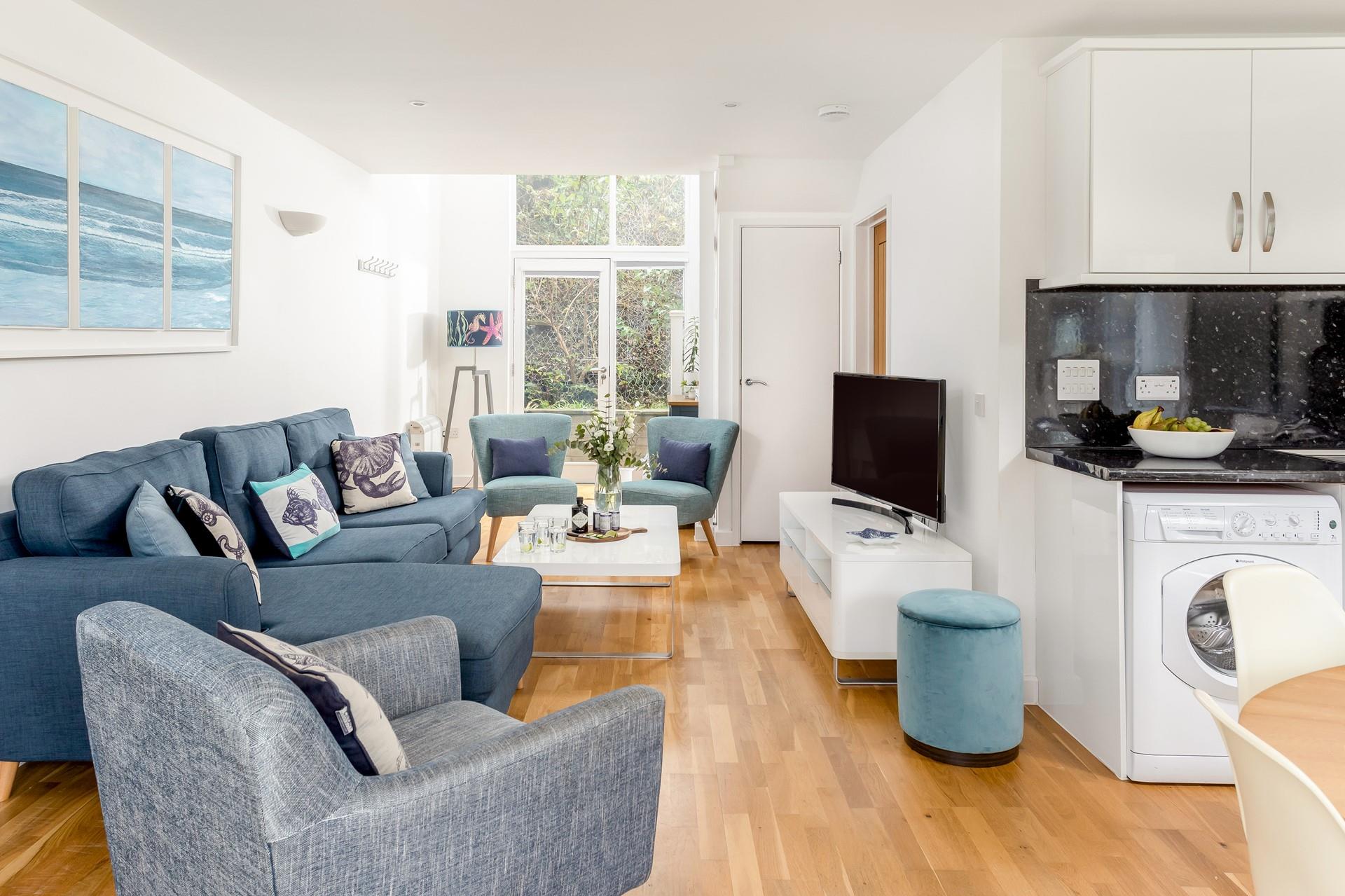 There are doors to an enclosed area at the rear which is perfect for leaving sandy gear after a day out on the beach!