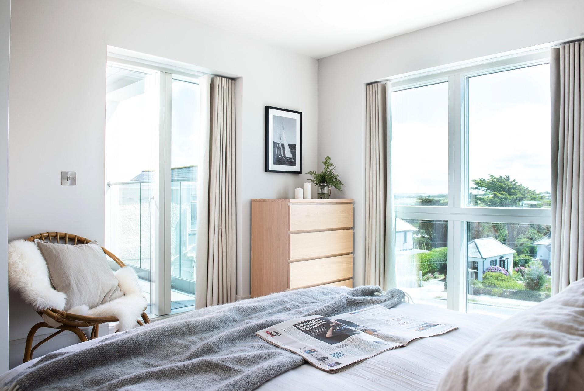 Large windows and doors to the patio flood this room with natural light, creating a bright and airy space.