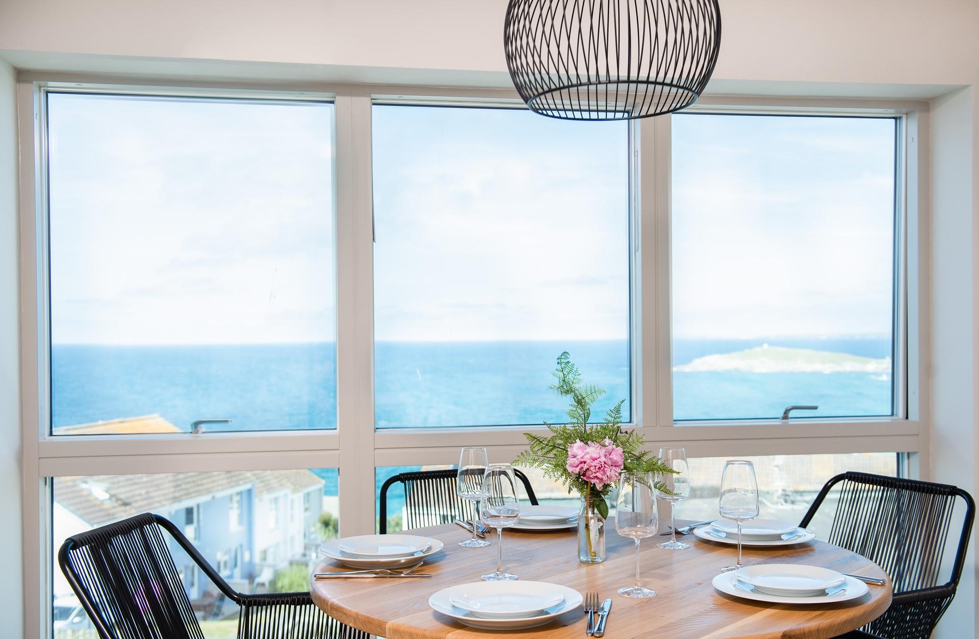 Take in the stunning views over breakfast around the stylish dining table. 
