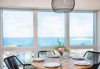 Take in the stunning views over breakfast around the stylish dining table. 