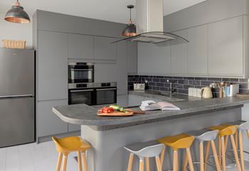 Gather together around the kitchen island as the family chef cooks up a storm!