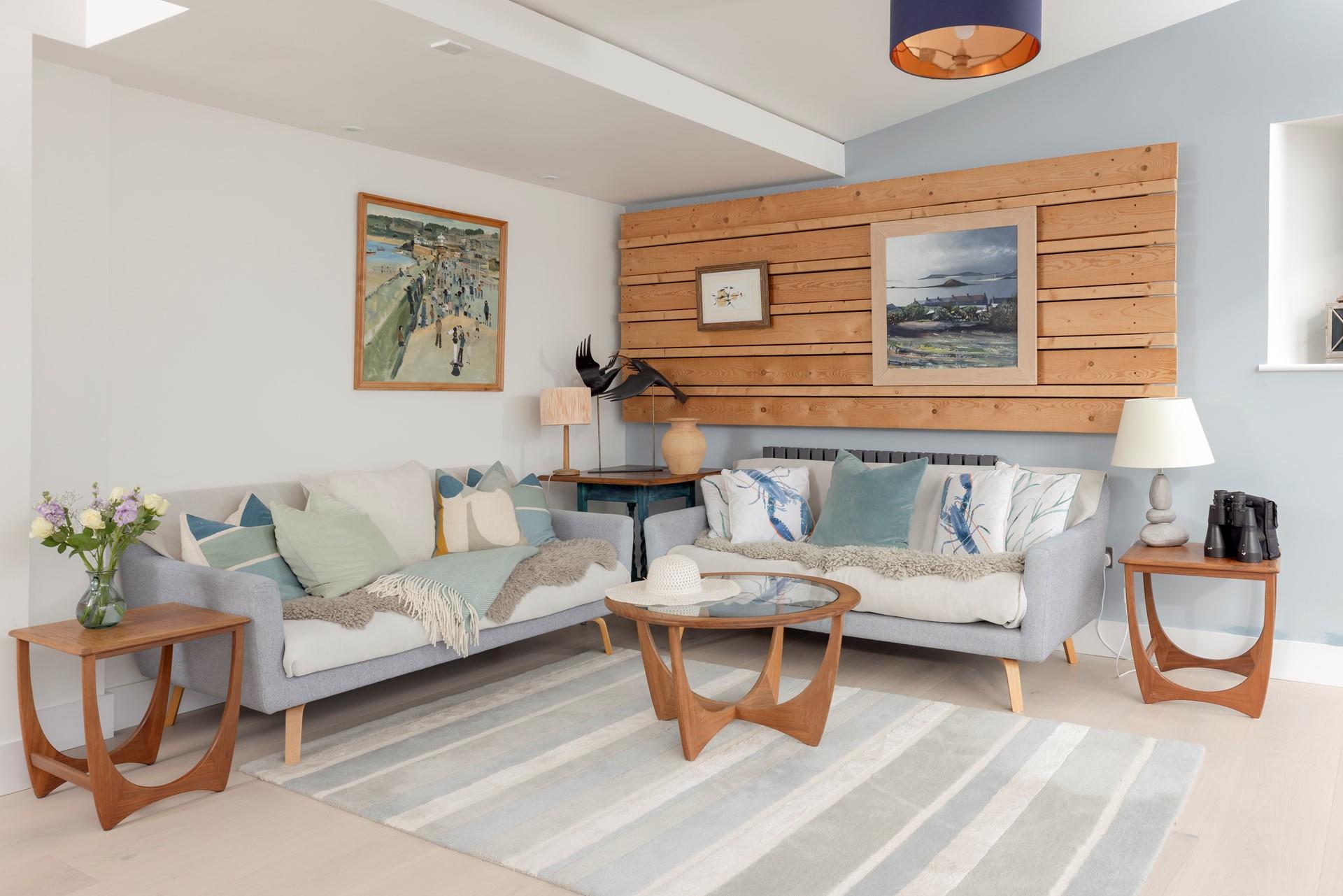 Shades of sea blues and greens create a calming living area.