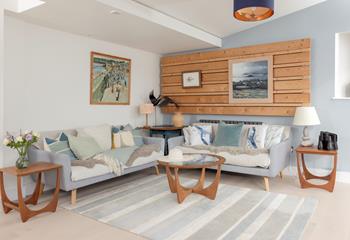 Shades of sea blues and greens create a calming living area.