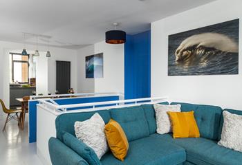 The open plan living space is stylishly finished with a sea theme.
