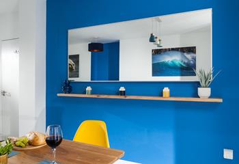 The apartment is decorated with bright colours and stylish interiors.