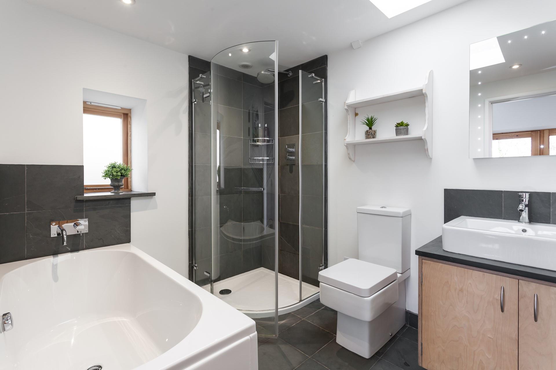 The family bathroom is perfect for an invigorating morning shower, or a relaxing evening bath.