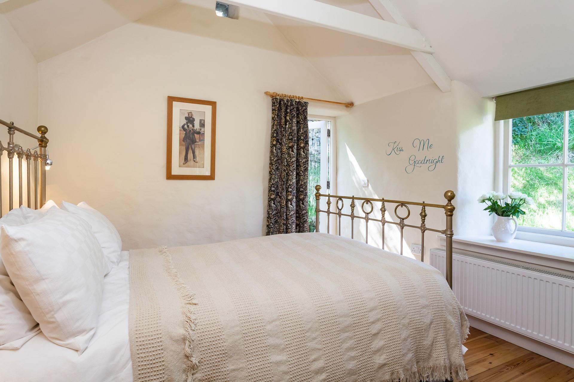 The dreamy bedroom is a relaxing retreat.