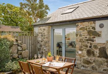Sip a glass of wine and soak up the sun and countryside views.