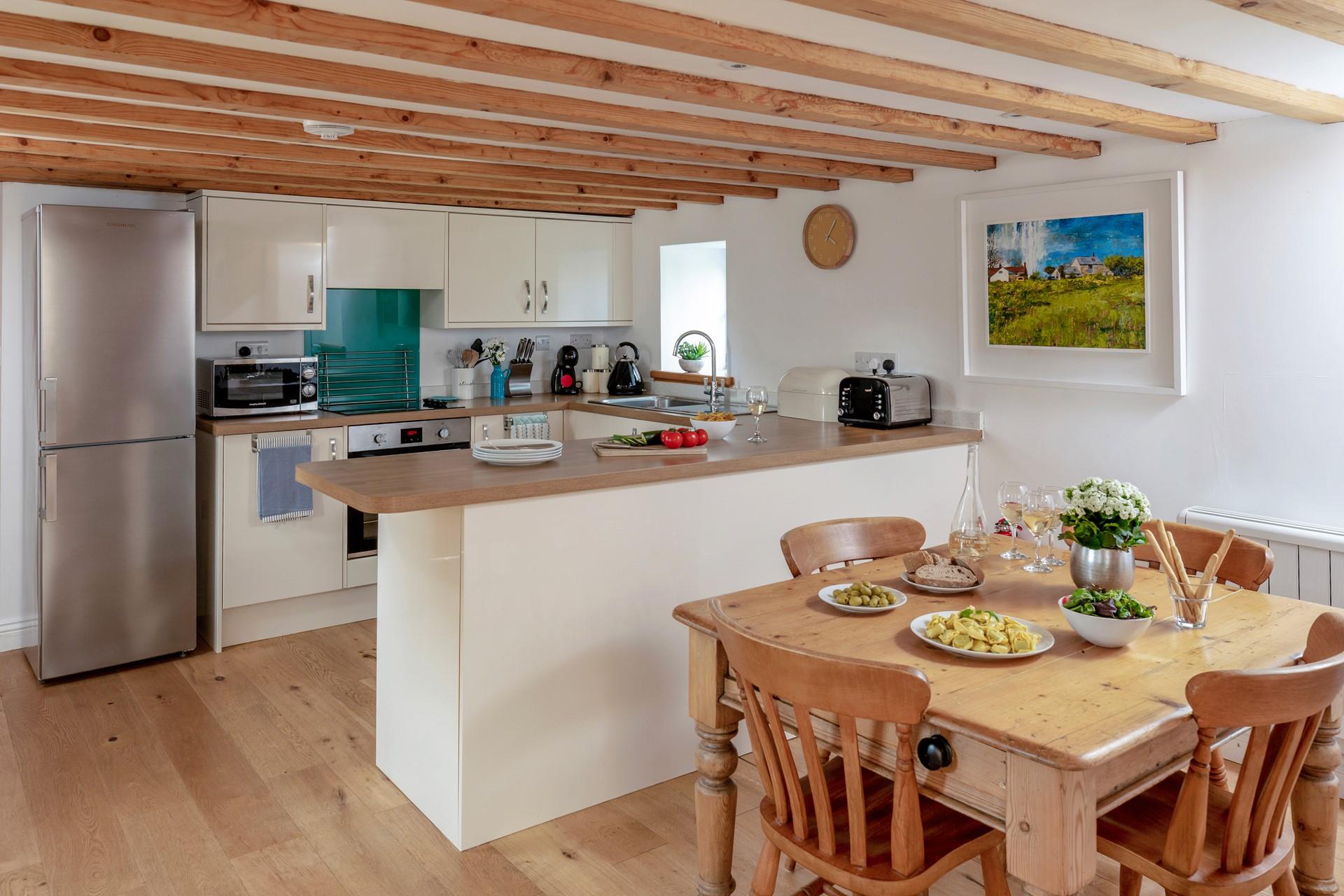 Exposed beams retain the traditional feel of the property.