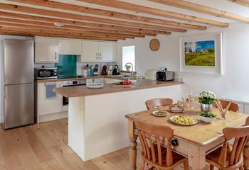 Exposed beams retain the traditional feel of the property.