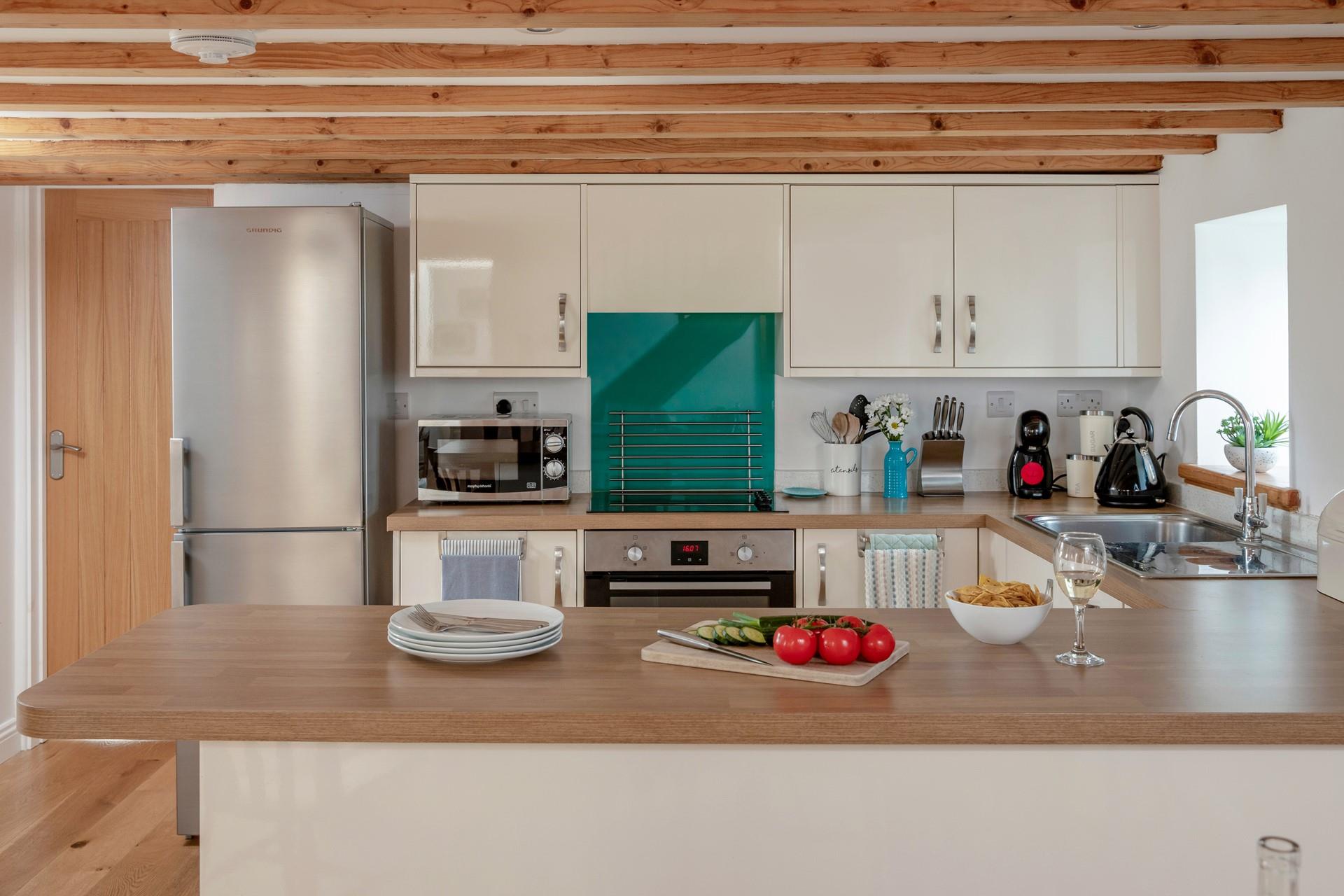 Rustle up a tasty feast in the fully equipped kitchen.