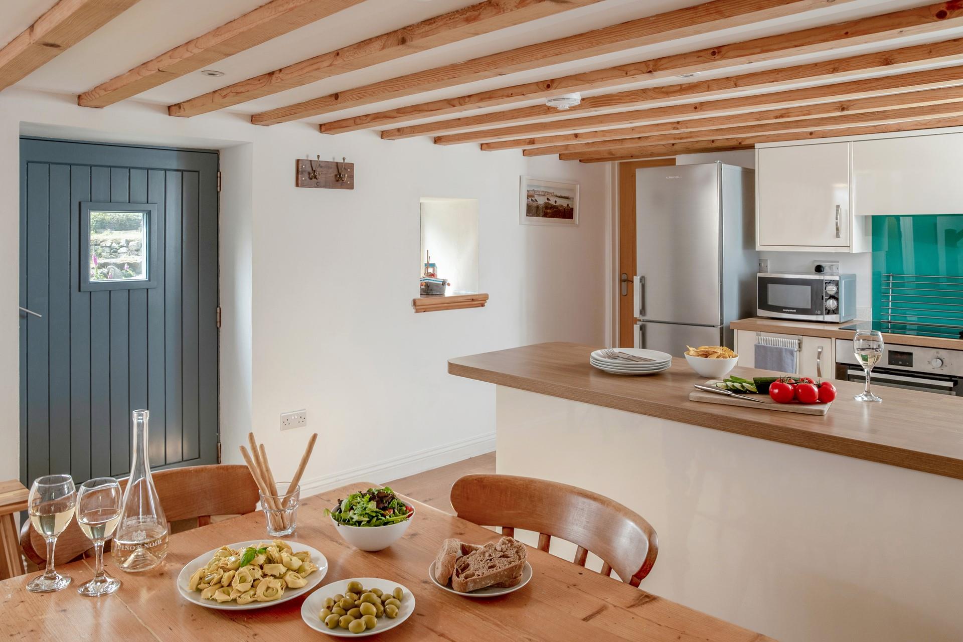 The country-style kitchen offers the perfect space to whip up delicious meals.