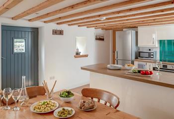 The country-style kitchen offers the perfect space to whip up delicious meals.