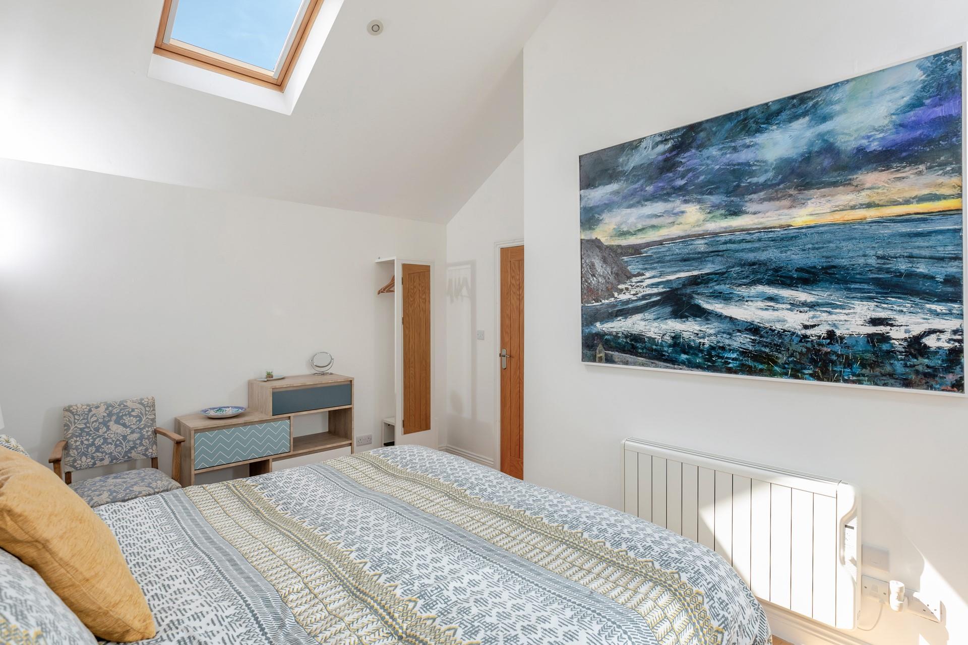 We love the coastal artwork in the bedroom!