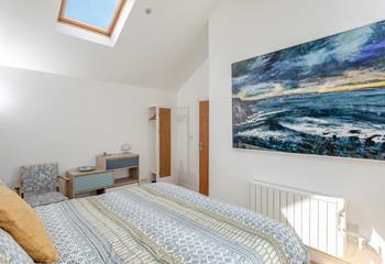 We love the coastal artwork in the bedroom!